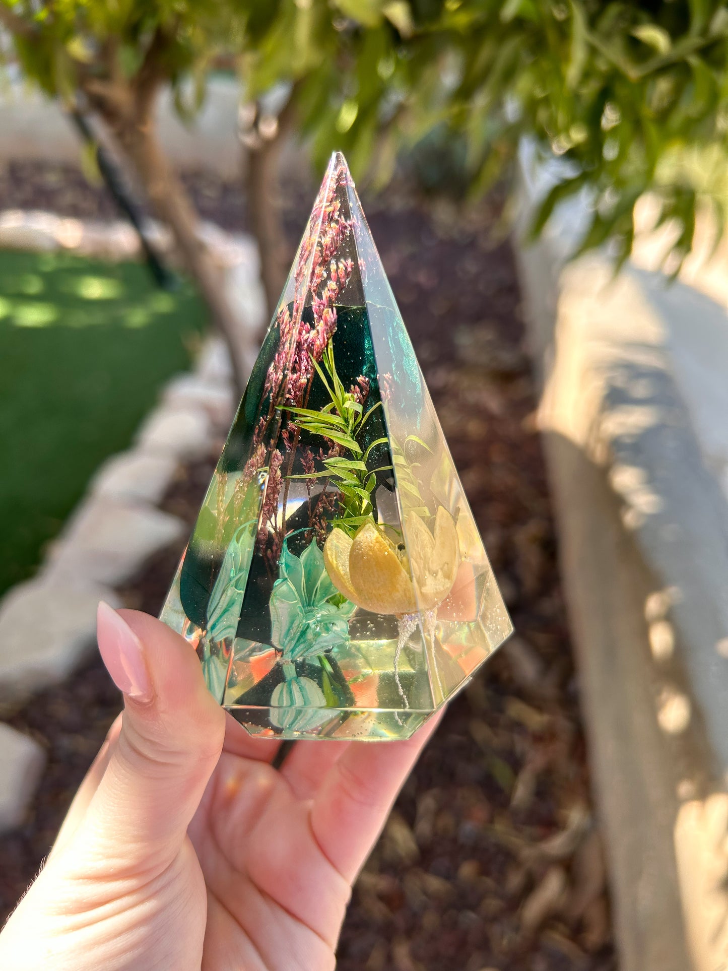 a beautiful handmade resin ring tree ring cone featuring floral dried botanicals. perfect for displaying rings, a unique botanical gift. beautiful vanity, bedroom, bathroom, office, tabletop, nightstand decor. Great as a unique gift for a loved one.