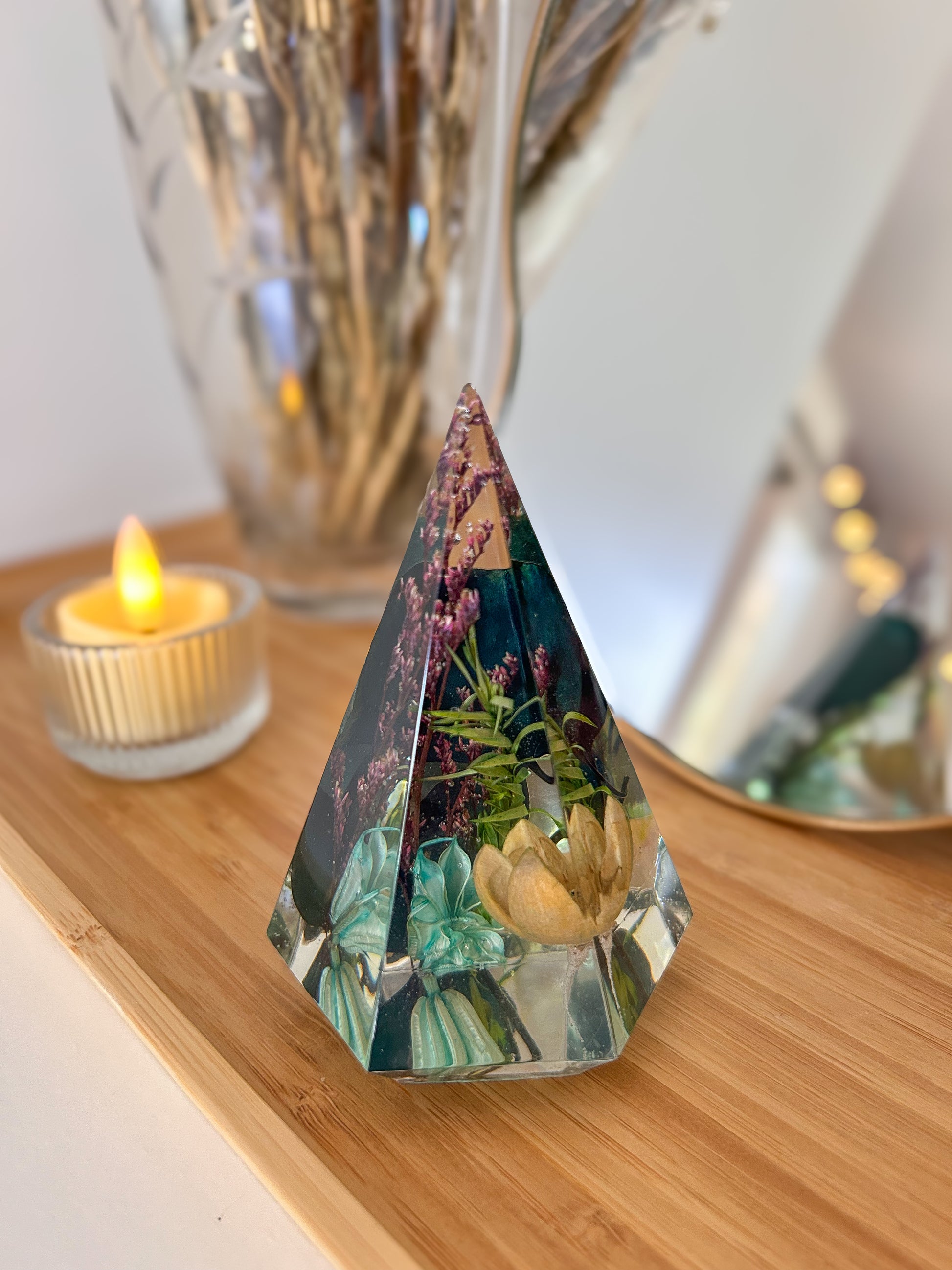 a beautiful handmade resin ring tree ring cone featuring floral dried botanicals. perfect for displaying rings, a unique botanical gift. beautiful vanity, bedroom, bathroom, office, tabletop, nightstand decor. Great as a unique gift for a loved one.