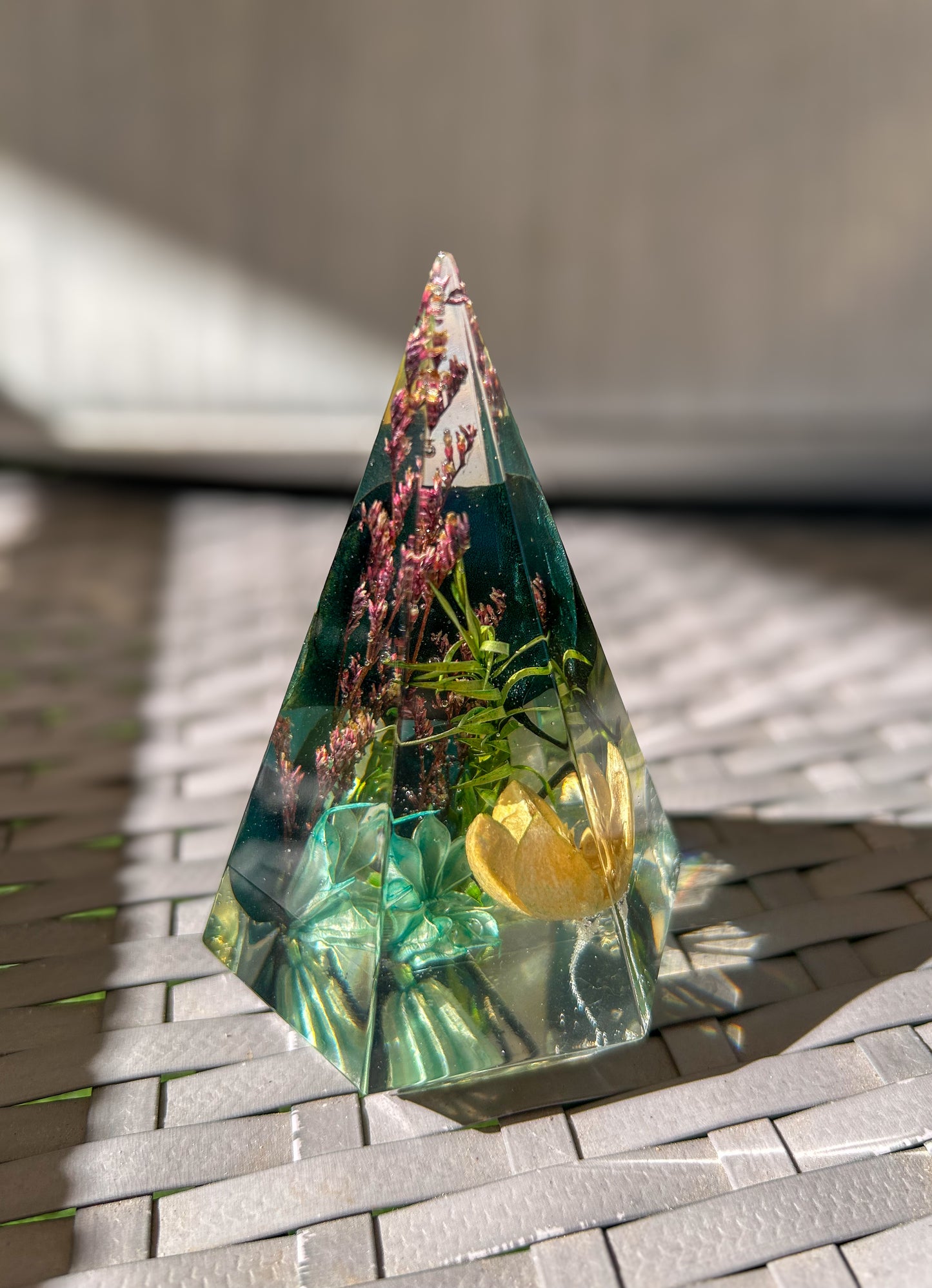 a beautiful handmade resin ring tree ring cone featuring floral dried botanicals. perfect for displaying rings, a unique botanical gift. beautiful vanity, bedroom, bathroom, office, tabletop, nightstand decor. Great as a unique gift for a loved one.