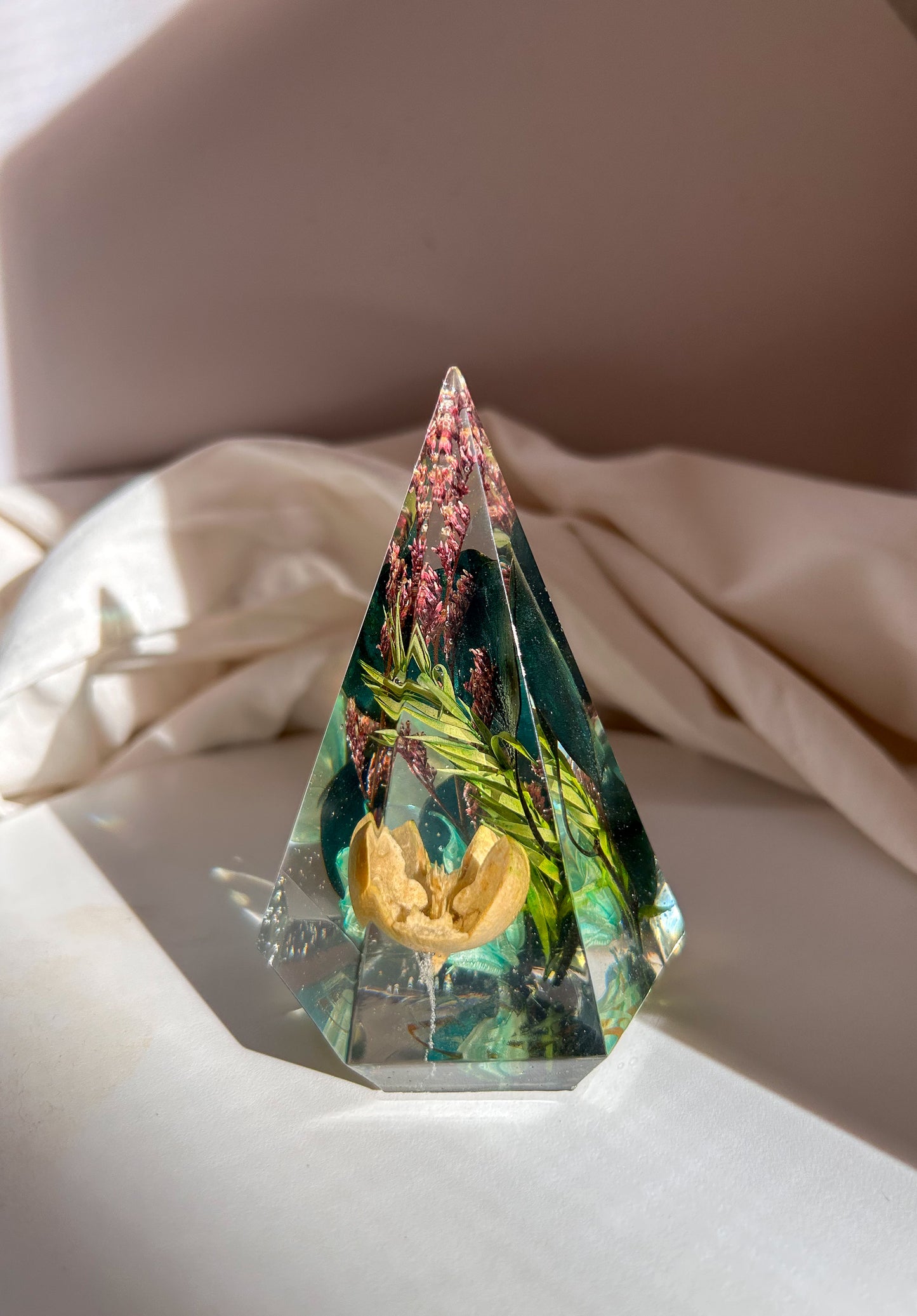 a beautiful handmade resin ring tree ring cone featuring floral dried botanicals. perfect for displaying rings, a unique botanical gift. beautiful vanity, bedroom, bathroom, office, tabletop, nightstand decor. Great as a unique gift for a loved one.