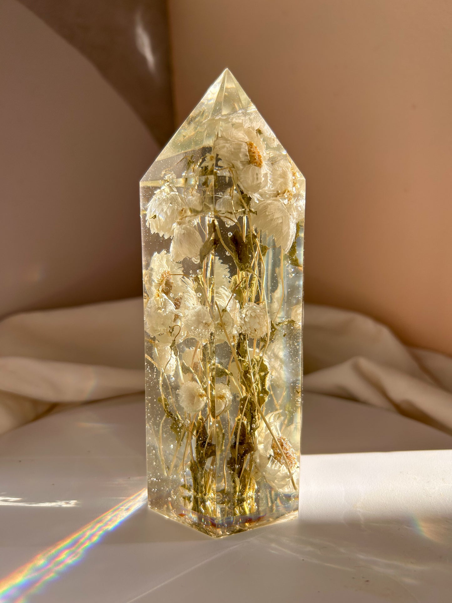 Handmade resin crystal tower featuring a real preserved dried flower daisy, captured in clear resin for a timeless look. Great for home decor, gifts, unique presents, vanity bedroom decor and shelf decor.