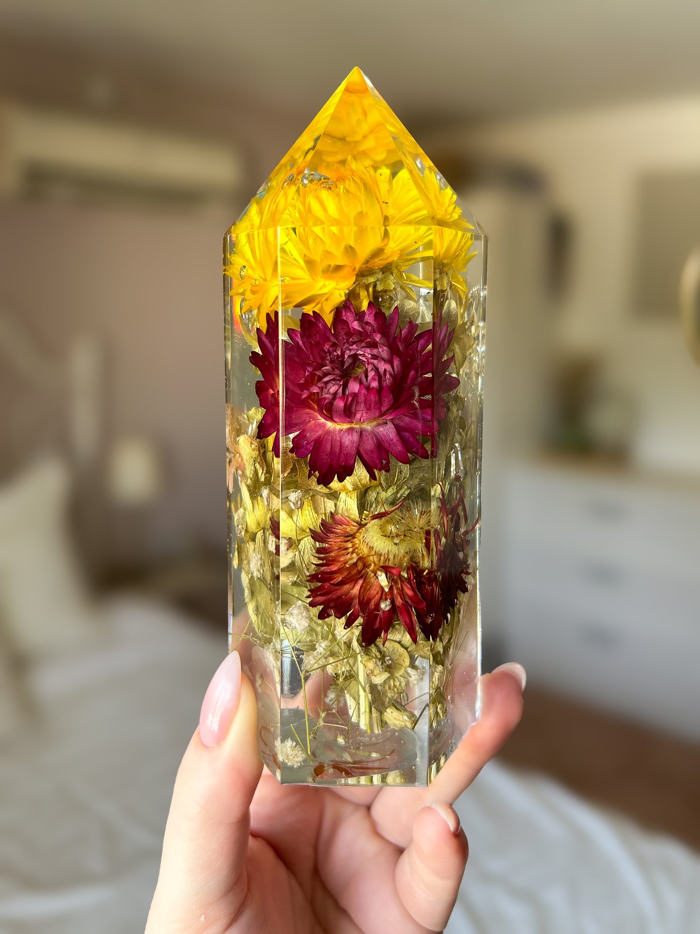 Handmade resin crystal tower featuring a real preserved colorful yellow orange purple pink green flowers, captured in clear resin for a timeless look. Great for home decor, gifts, unique presents, vanity bedroom decor and shelf decor.