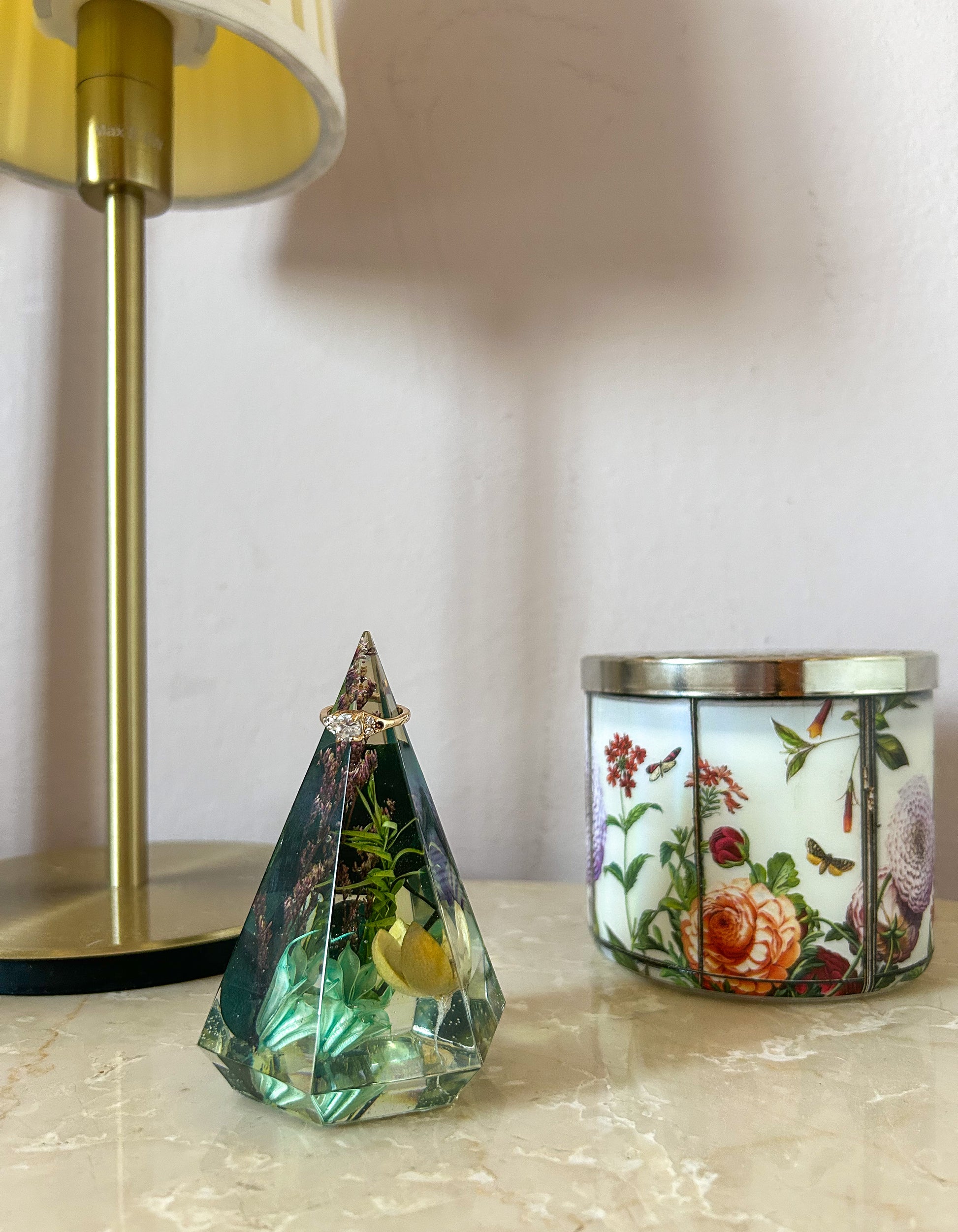 a beautiful handmade resin ring tree ring cone featuring floral dried botanicals. perfect for displaying rings, a unique botanical gift. beautiful vanity, bedroom, bathroom, office, tabletop, nightstand decor. Great as a unique gift for a loved one.