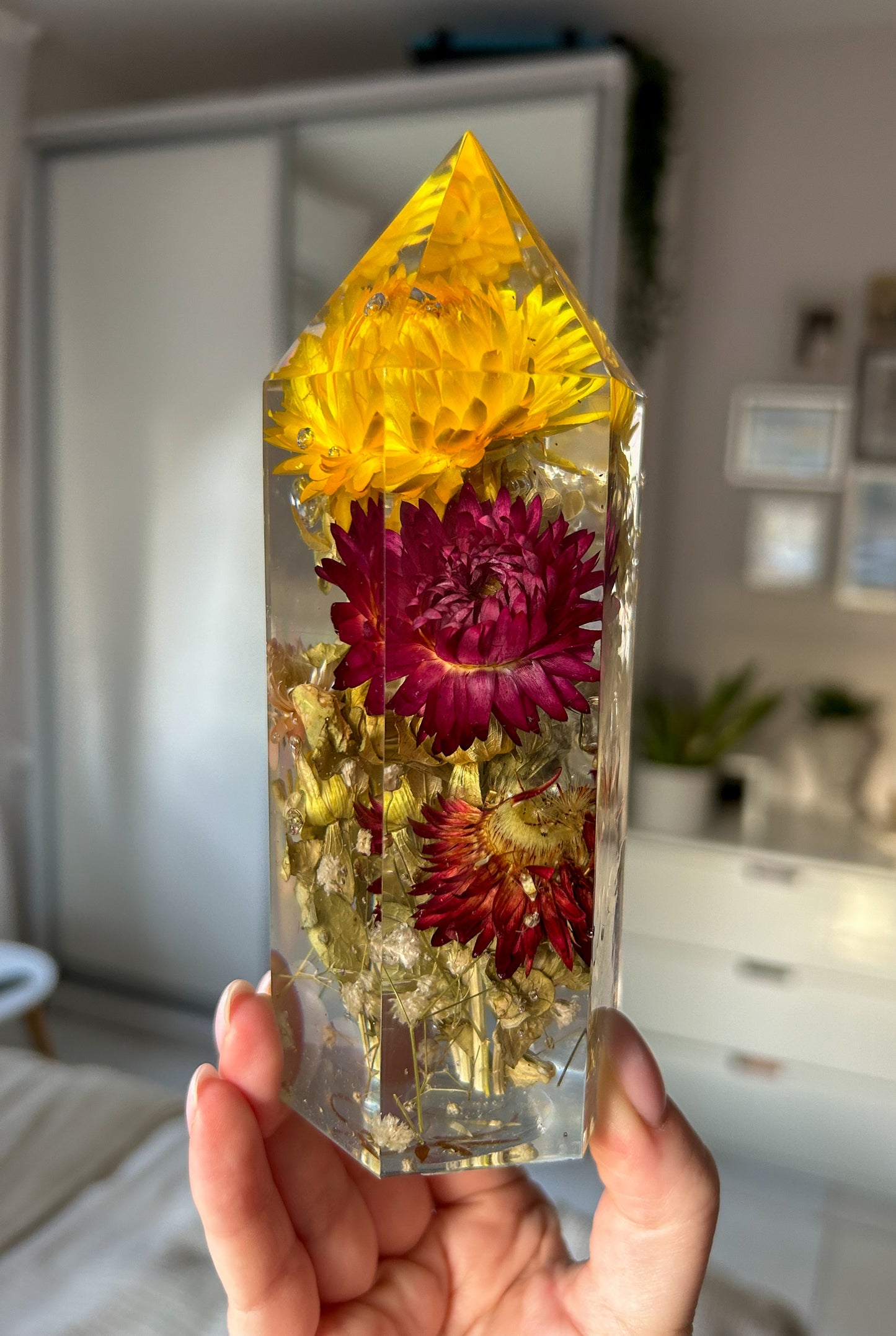 Handmade resin crystal tower featuring a real preserved colorful yellow orange purple pink green flowers, captured in clear resin for a timeless look. Great for home decor, gifts, unique presents, vanity bedroom decor and shelf decor.