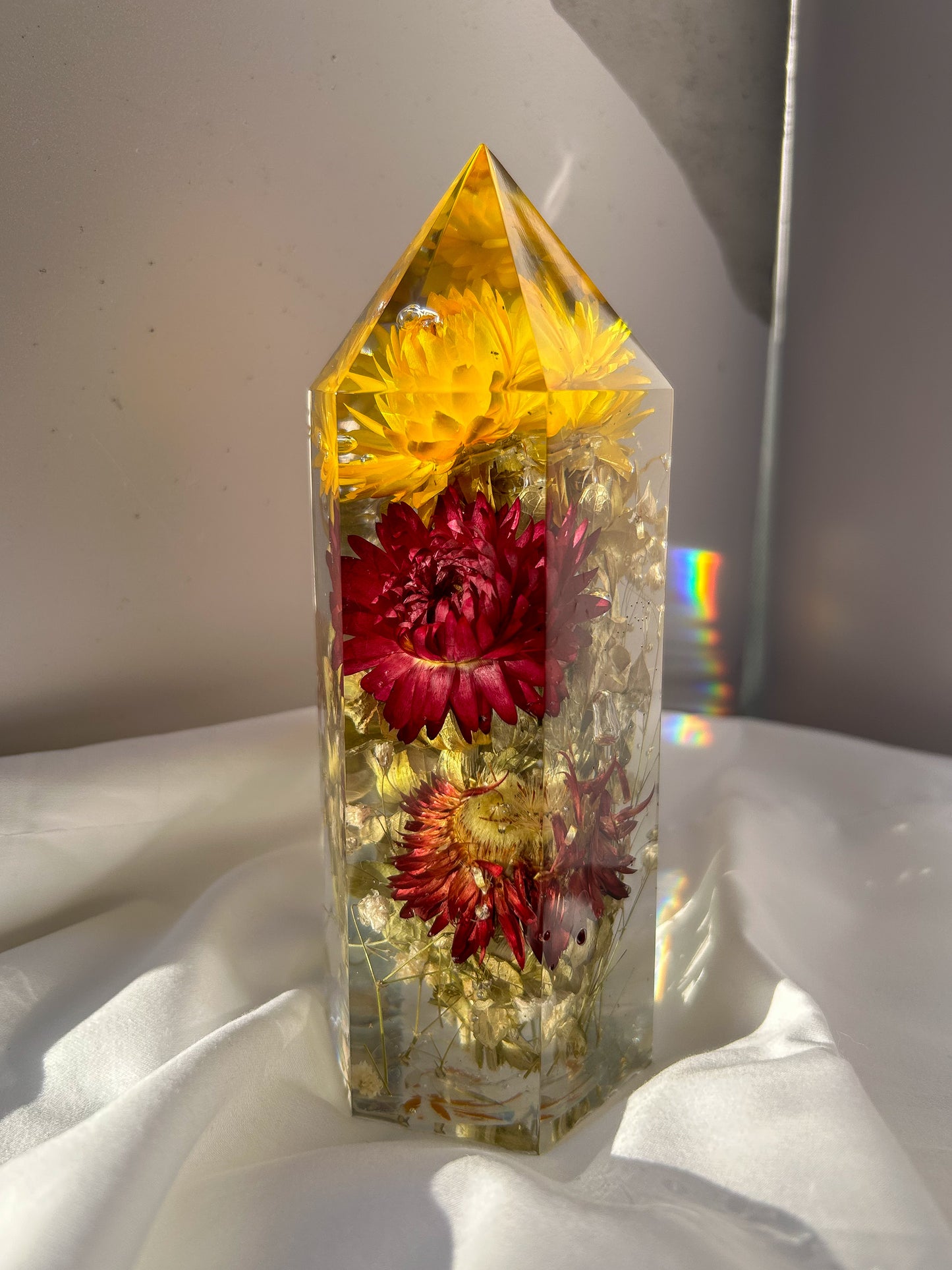 Handmade resin crystal tower featuring a real preserved colorful yellow orange purple pink green flowers, captured in clear resin for a timeless look. Great for home decor, gifts, unique presents, vanity bedroom decor and shelf decor.