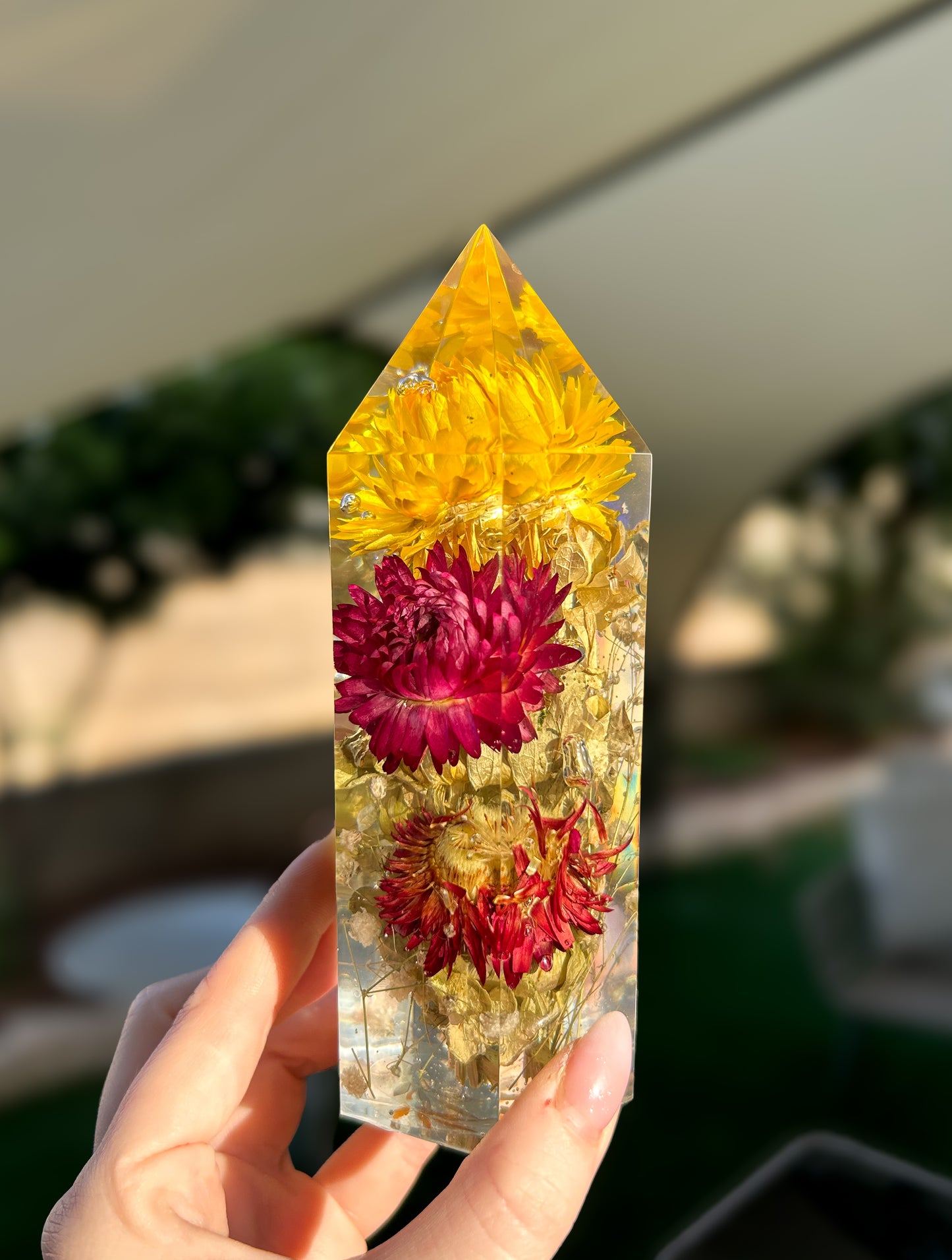 Handmade resin crystal tower featuring a real preserved colorful yellow orange purple pink green flowers, captured in clear resin for a timeless look. Great for home decor, gifts, unique presents, vanity bedroom decor and shelf decor.