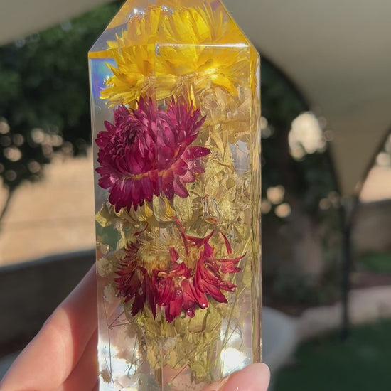 Handmade resin crystal tower featuring a real preserved colorful yellow orange purple pink green flowers, captured in clear resin for a timeless look. Great for home decor, gifts, unique presents, vanity bedroom decor and shelf decor.